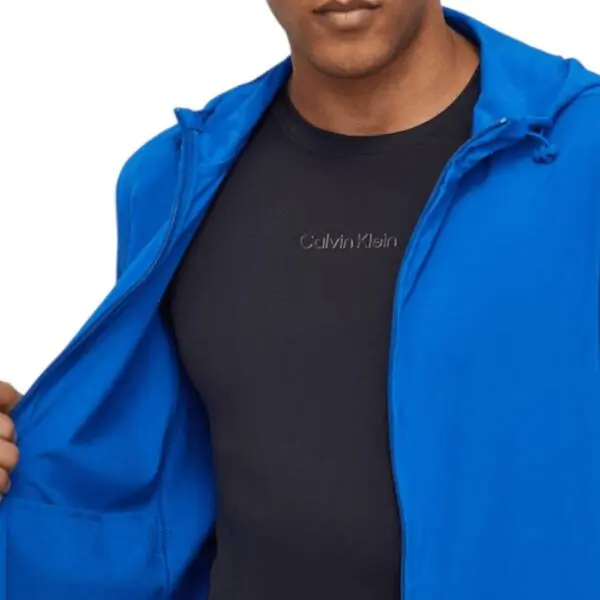 Calvin Klein - Ανδρικό Μεταβατικό Μπουφάν Performance Regular Fit 00GMS4O520-CGN Μπλε 00GMS4O520-CGN