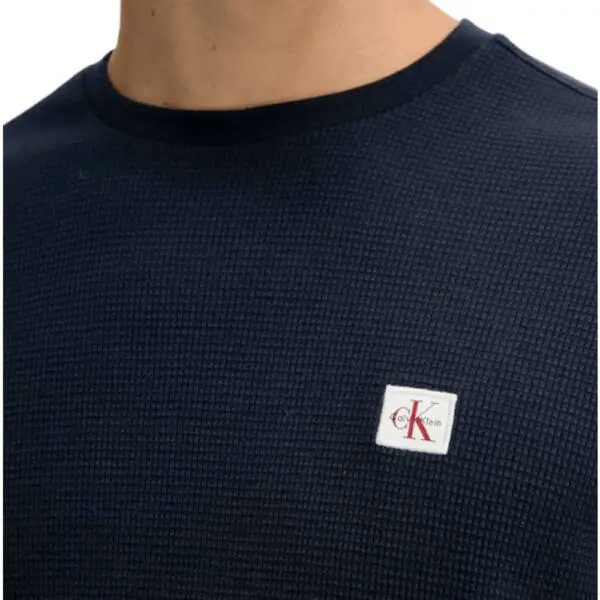 Calvin Klein - Ανδρικό Πουλόβερ Badge Waffle LS Tofu LV040EM217-WFW Μπλε Σκούρο LV040EM217-WFW
